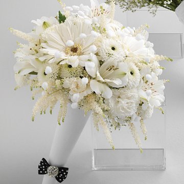This bouquet of orchids stephanotis roses and ivy is the perfect example